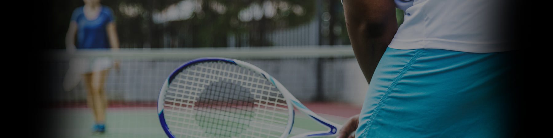 Photo of a pairs game of Tennis